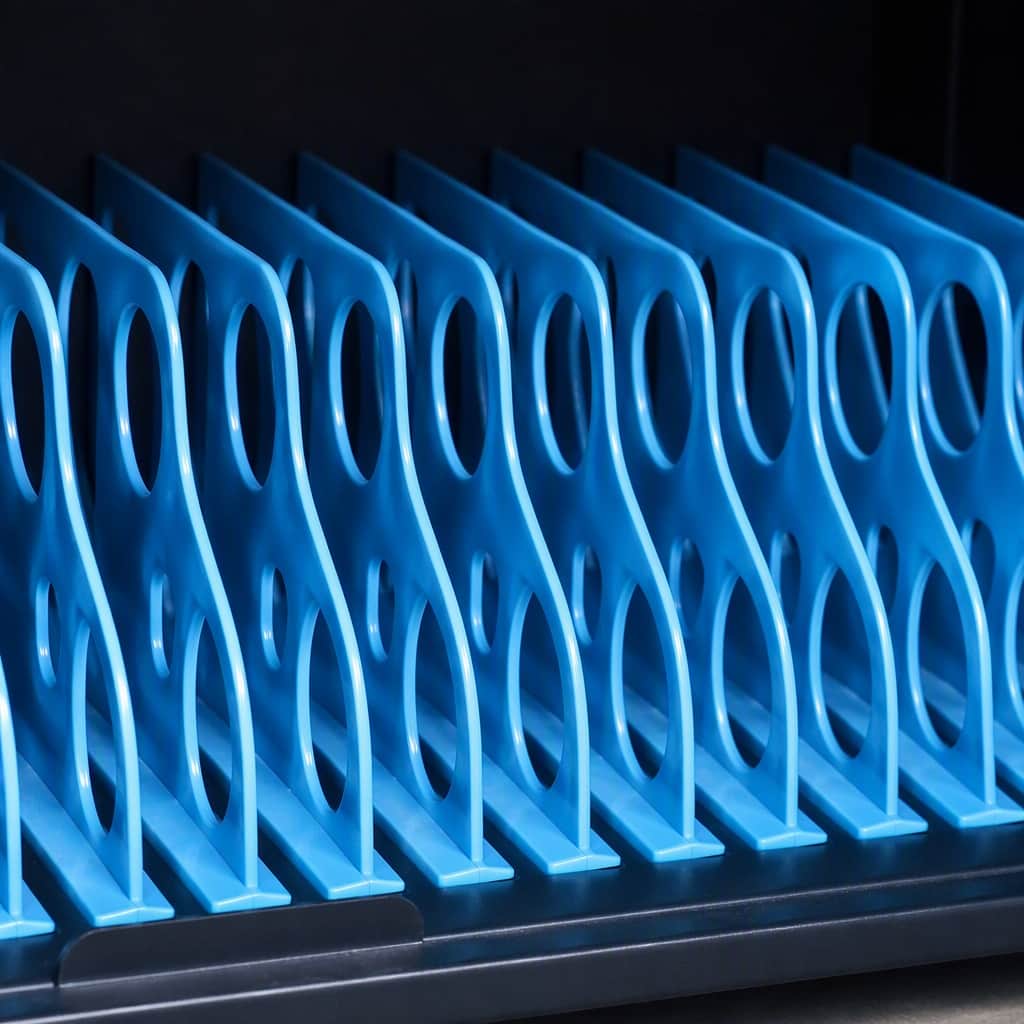 Independent blue storage compartments for 16-slot tablet charging station Independent blue storage compartments for 16-slot tablet charging station